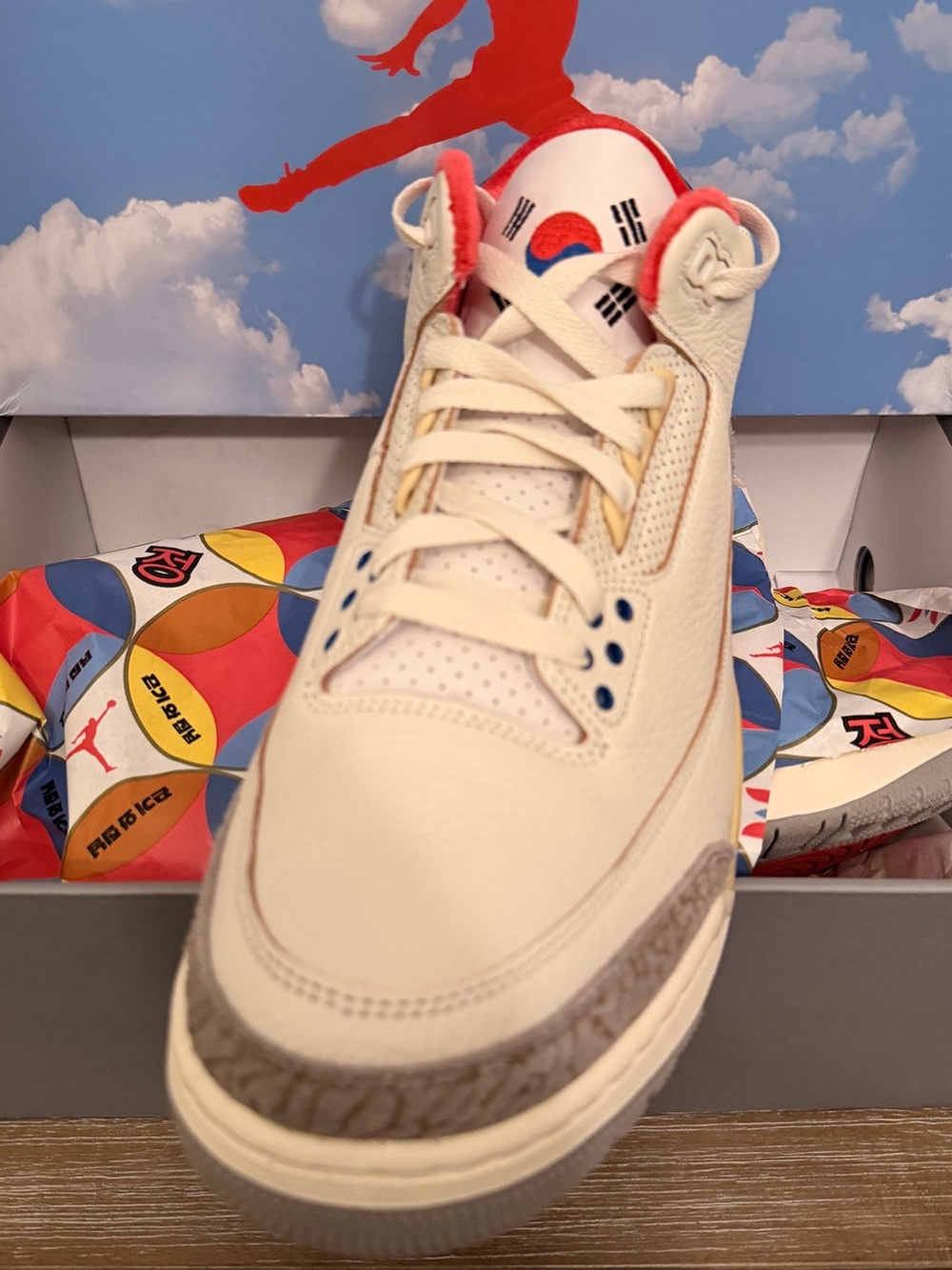 Jordan Retro Low Top Sneakers in Cream with Red and Blue Accents